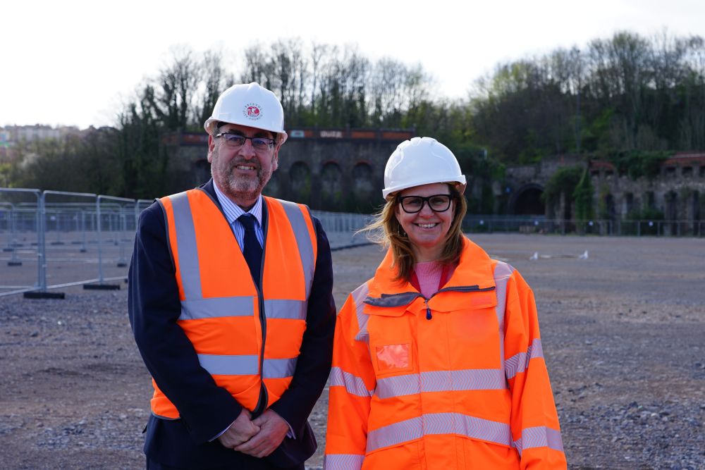 Helen Godwin and Tony Dyer in hard hats and orange high-vis jackets